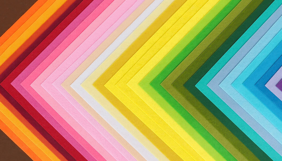 Decorative paper layout in a triangle pattern showing off different colours.