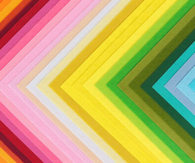 Decorative paper layout in a triangle pattern showing off different colours.